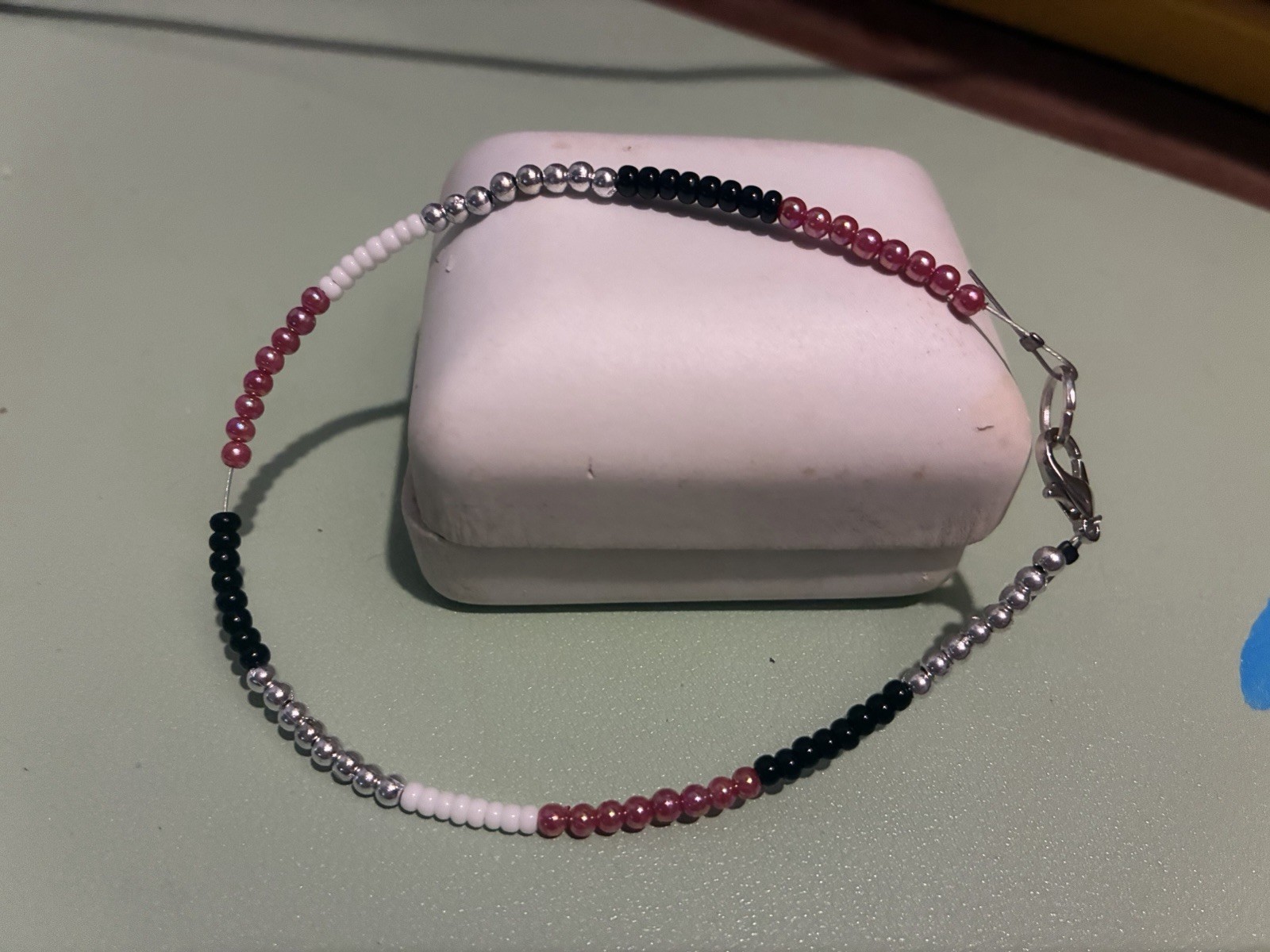 Multicolor Glass Beaded Bracelet with Lobster Clasp Closure.