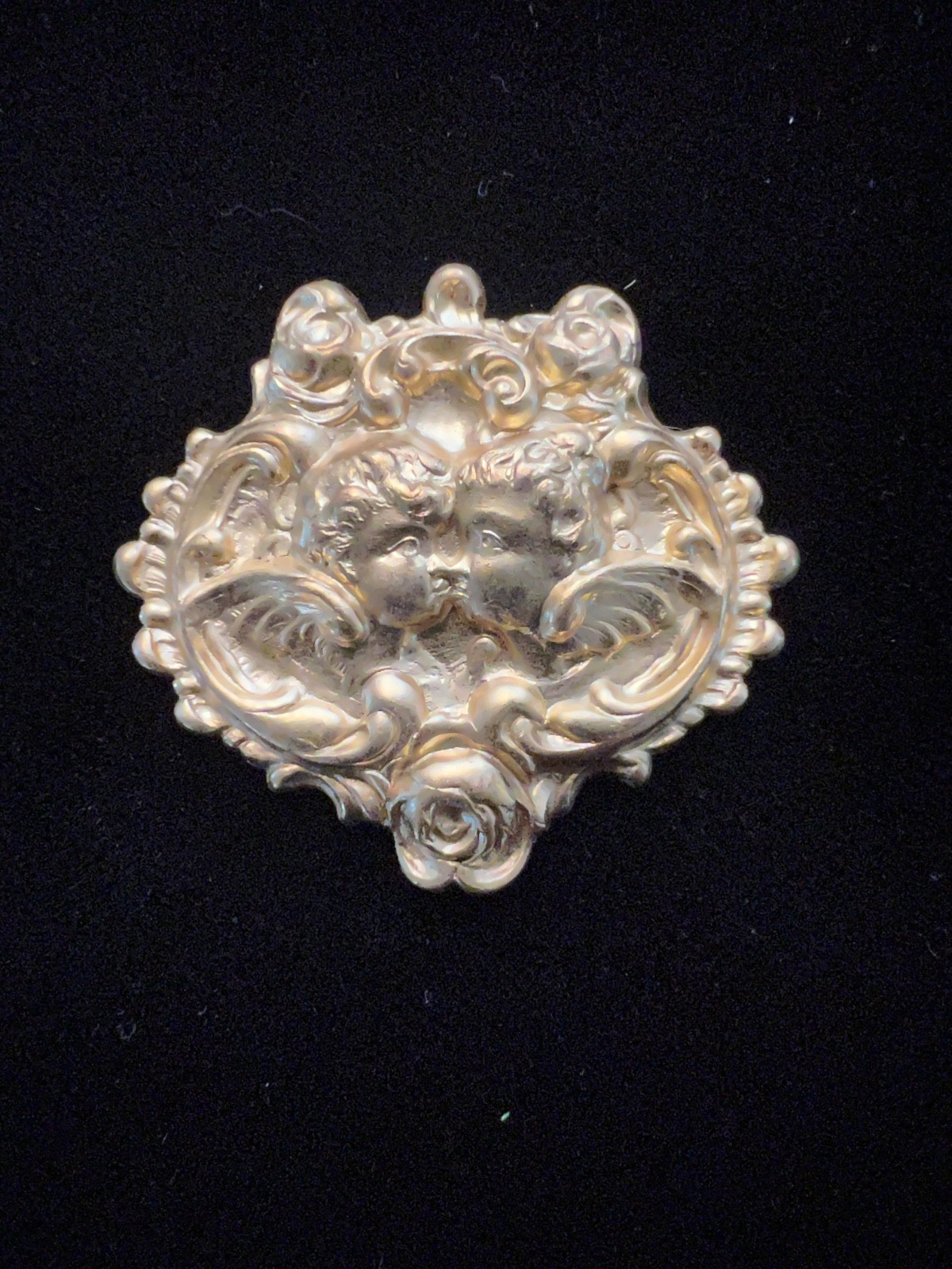 Cherubs kissing with rose detail Brass stamping. Vintage/Antique for Pin/Bolo.