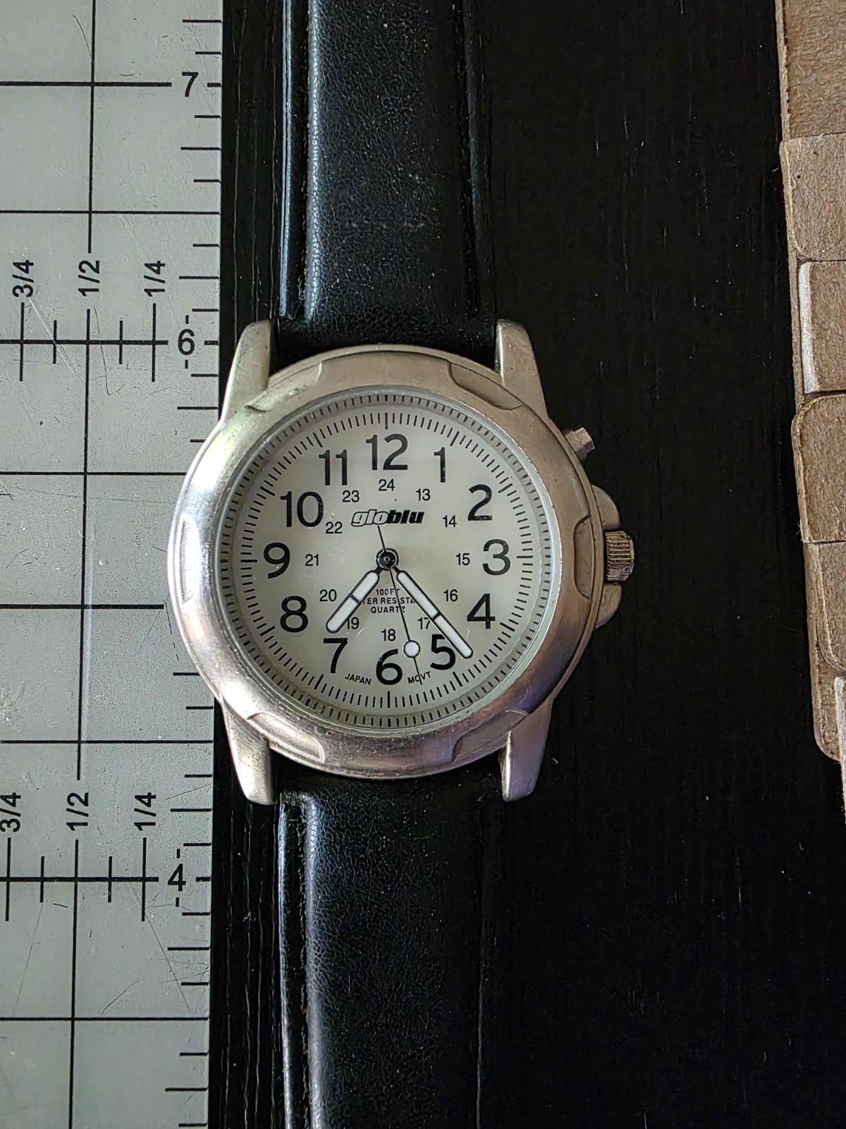 Glo Watch 1 5/8 in blue face 9 in black band