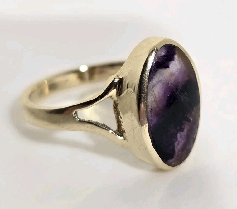 9ct Yellow gold open work ring. Collet set with an oval Blue John Cabochon.