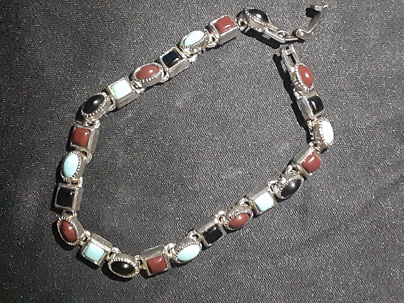 Bracelet Silver Tone(Not Silver)Multi Colored Stones Black, Blue and Burgundy.