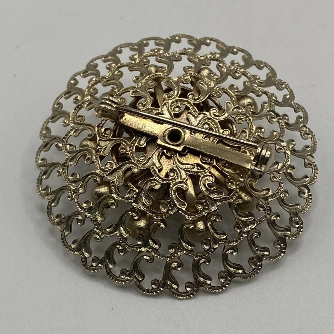 Gold Tone Round Filigree Brooch Pin w/ Purple Crystal Rhinestones, 2 in