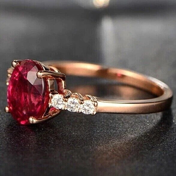 3.00 Ct Oval Cut Lab Created Ruby Halo Engagement Ring In 14K Rose Gold Plated.