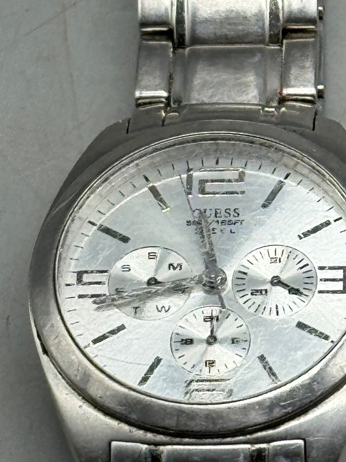 guess steel men’s watch 50 meters 165 feet water resistant made in Japan READ