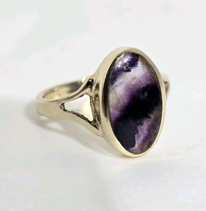 9ct Yellow gold open work ring. Collet set with an oval Blue John Cabochon.