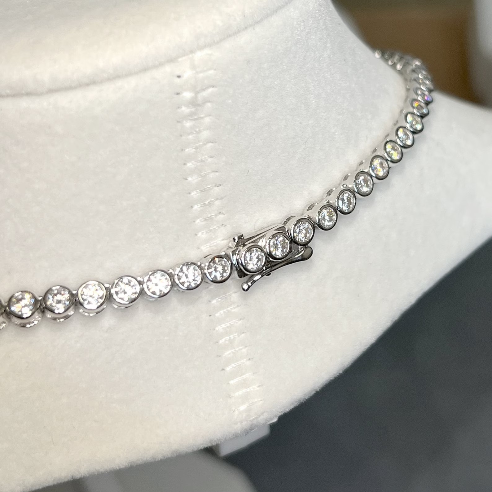 25 TCW Round Cut Moissanite Iced Bezel Tennis Necklace in 14K White Gold Plated