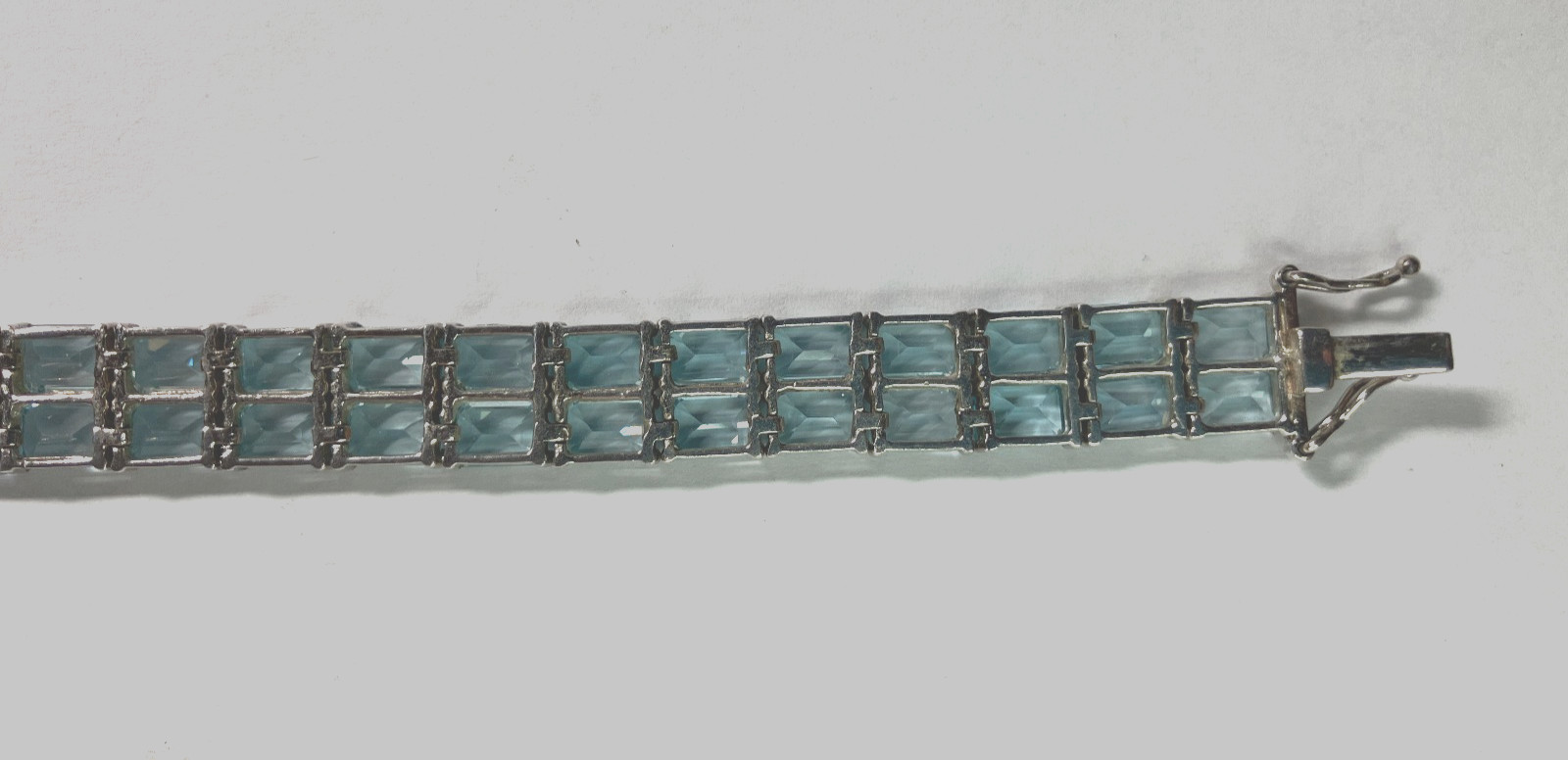 8” TENNIS BRACELET -ADI 925 STERLING SILVER – 40 EMERALD CUT TOPAZ STONES -NICE!