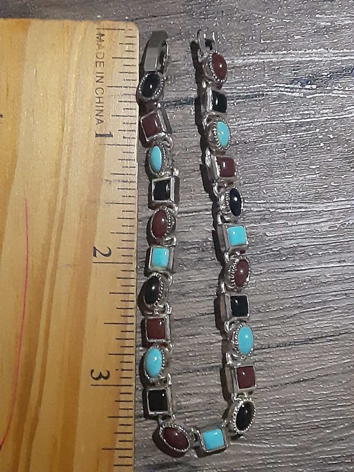 Bracelet Silver Tone(Not Silver)Multi Colored Stones Black, Blue and Burgundy.