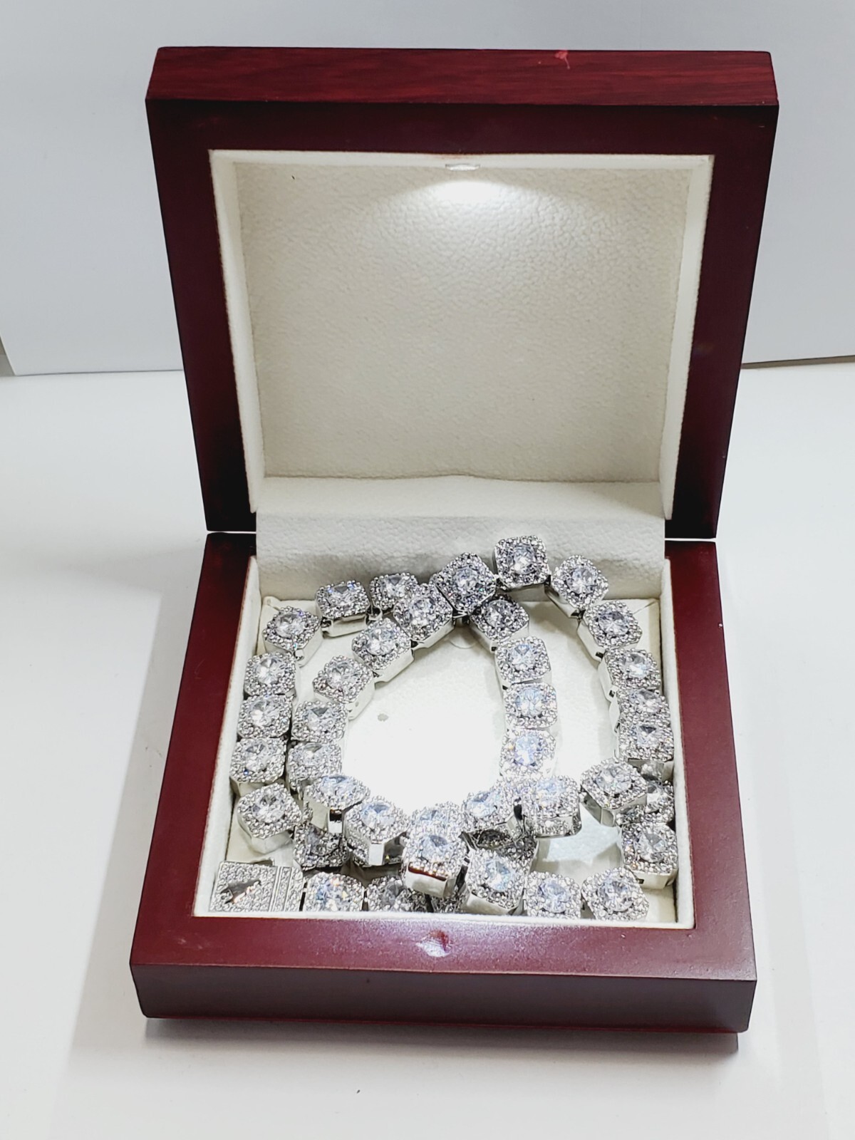 The Jewelry Plug Clustered Tennis Necklace in White Gold Plating