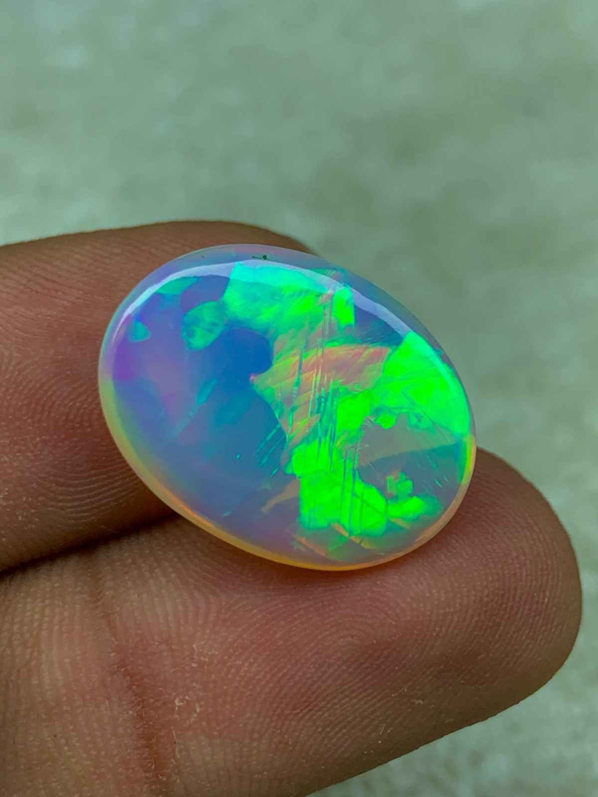 Natural Ethiopian Opal 8.30 Carat Oval Cabochon Rainbow Fire Welo Gemstone