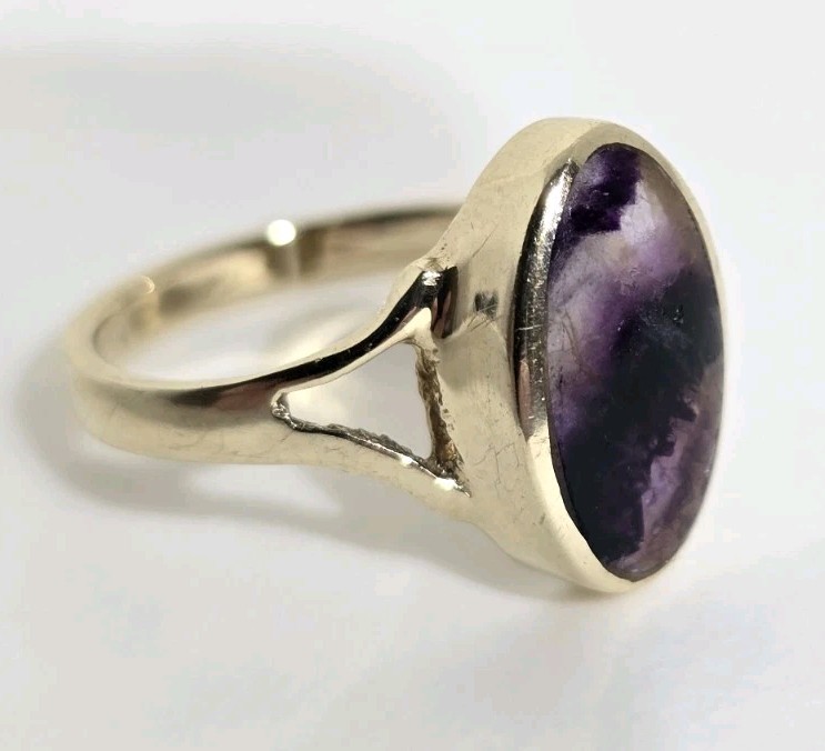 9ct Yellow gold open work ring. Collet set with an oval Blue John Cabochon.