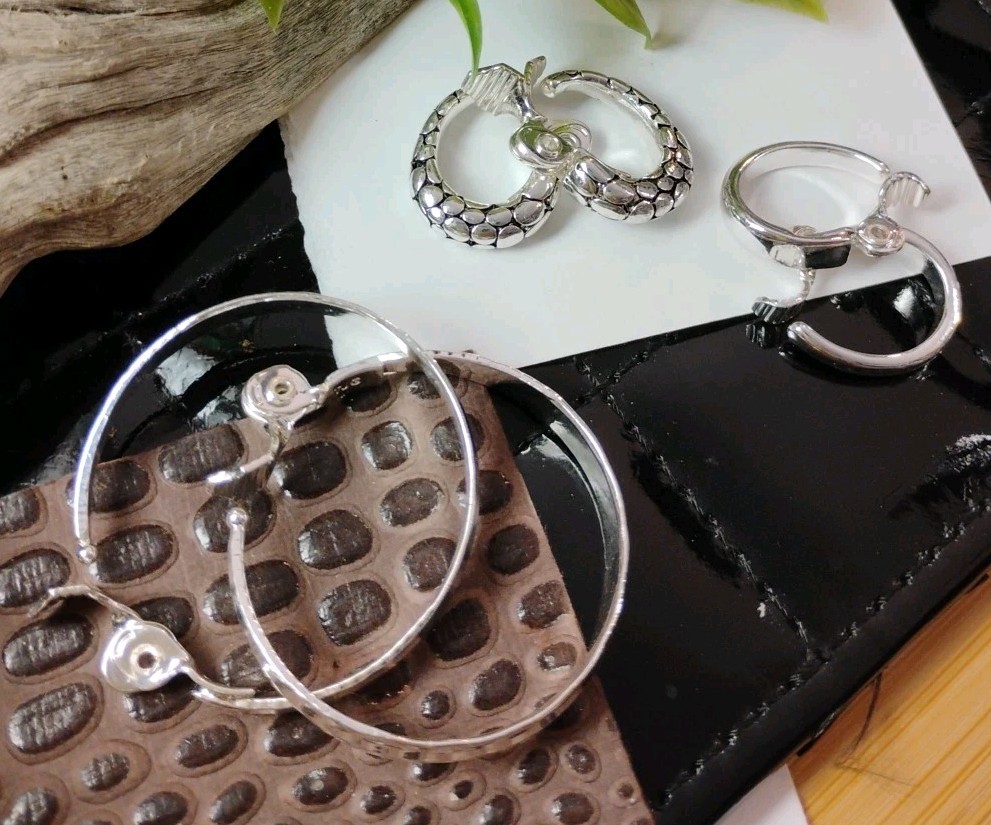 The JEWELRY GROUP TJG Set of THREE (3) Silver Toned Hoop Clip On Earrings!