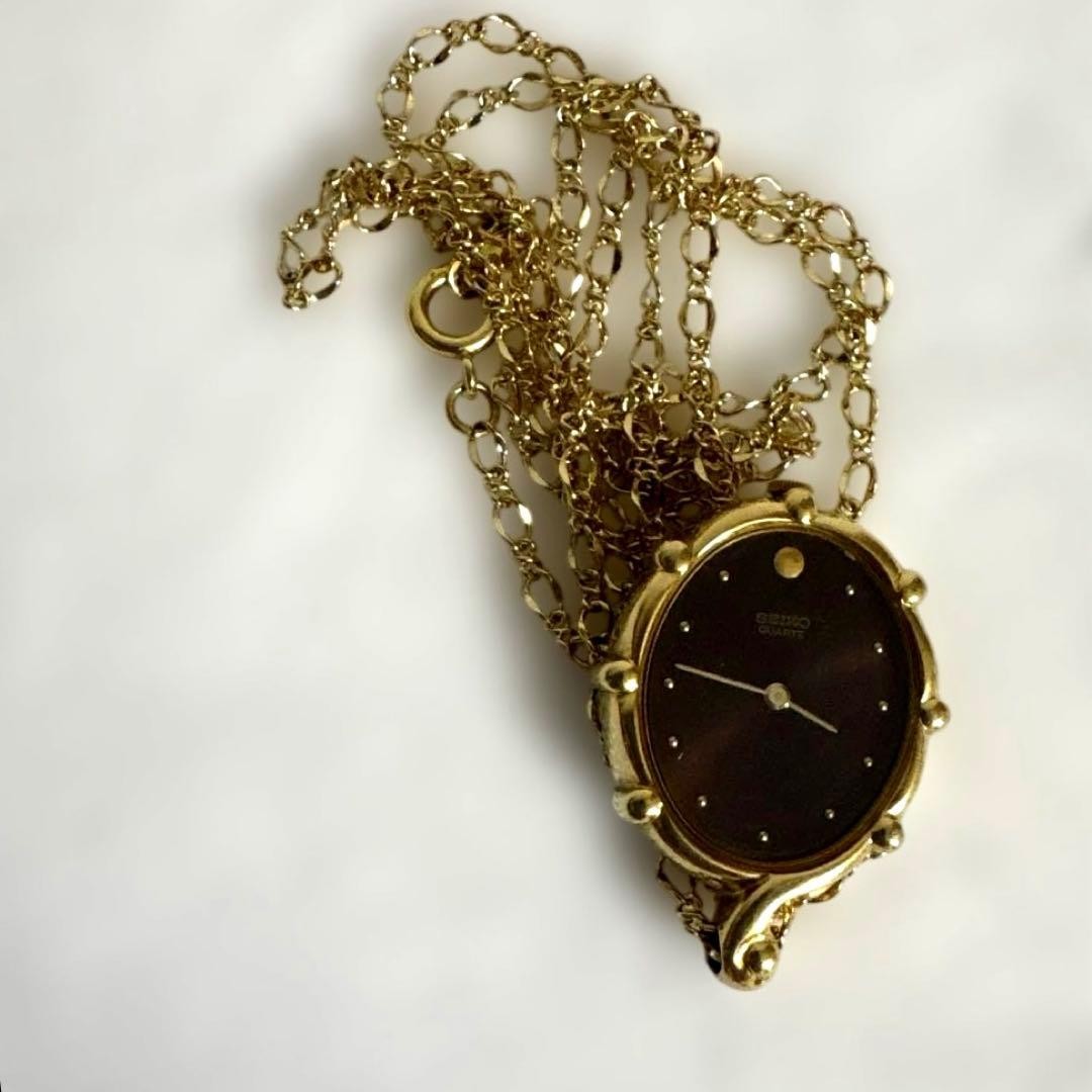 Seiko pendant watch, gold chain, working, burgundy dial.