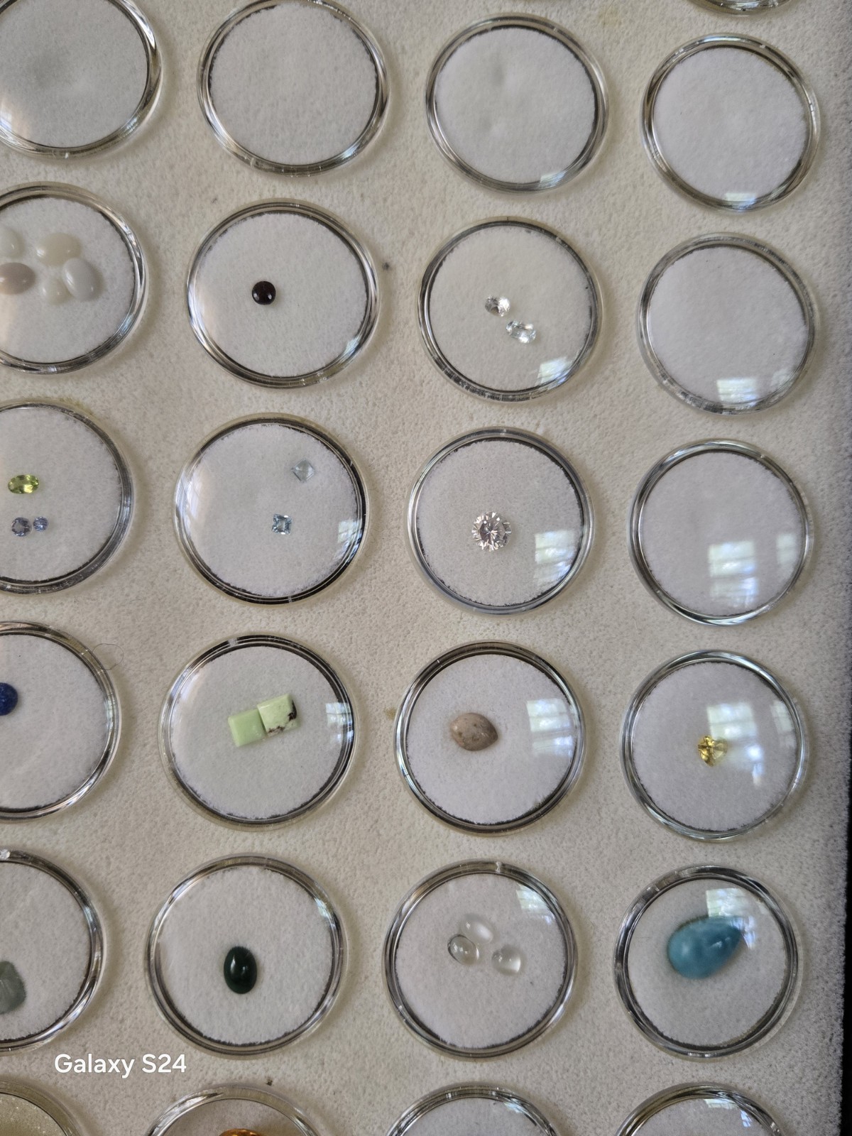 Lots Of Loose Faceted Mixed Colors Gemstones In A Display Case- ** ESTATE…
