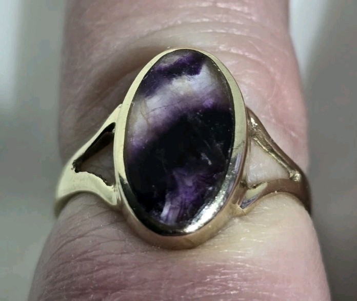 9ct Yellow gold open work ring. Collet set with an oval Blue John Cabochon.