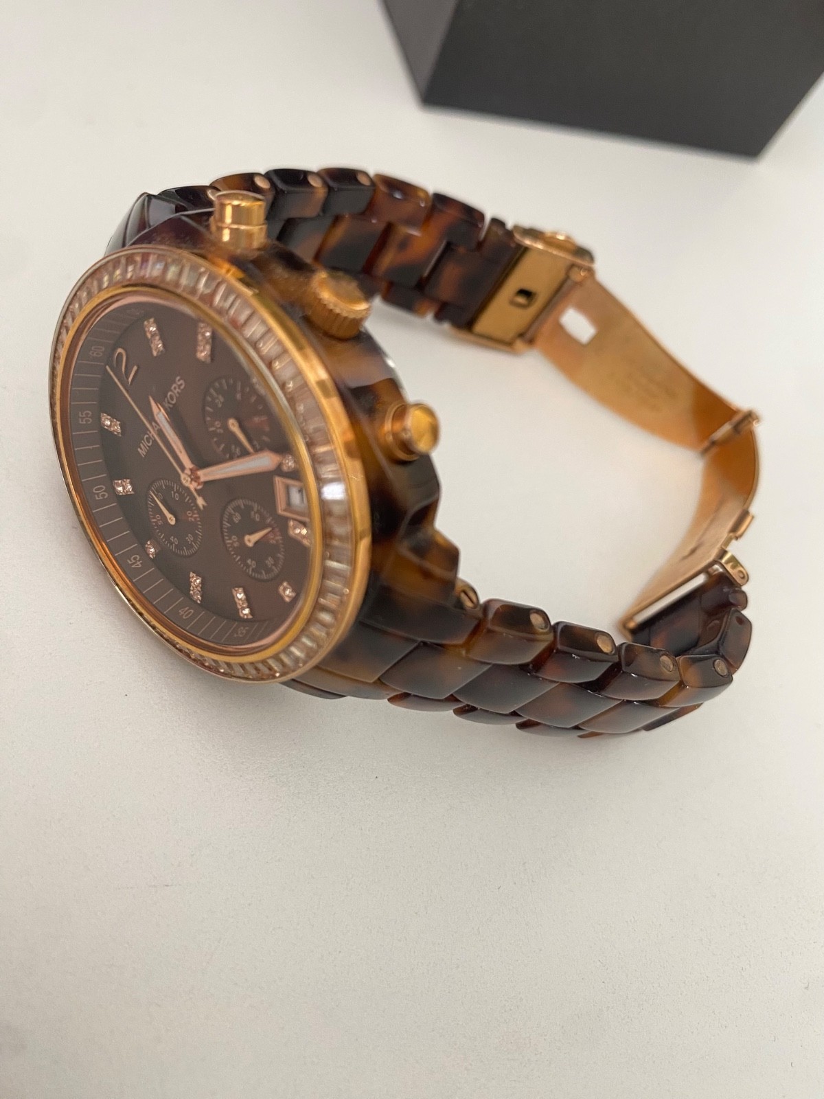 Michael Kors Watch for Women. Stainless steal case back, tortoiseshell wristband