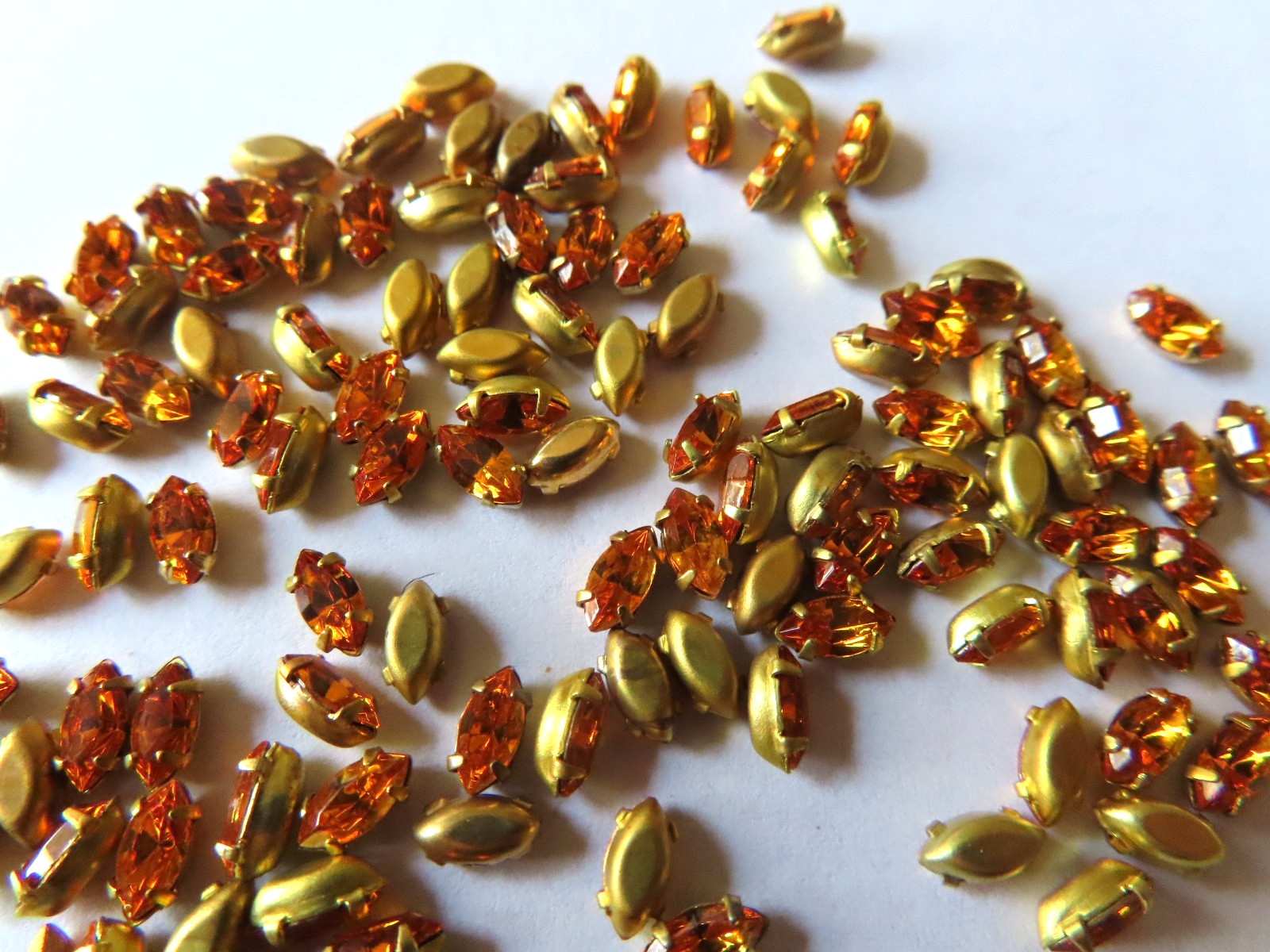144 Swarovski Navette Rhinestones 6x3mm topaz/Brass settings.