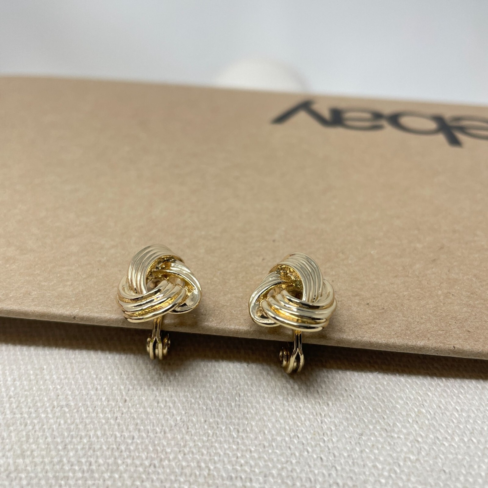 The Jewelry Group TJG Signed Gold Tone Knotted Clip On Statement Earrings Marked