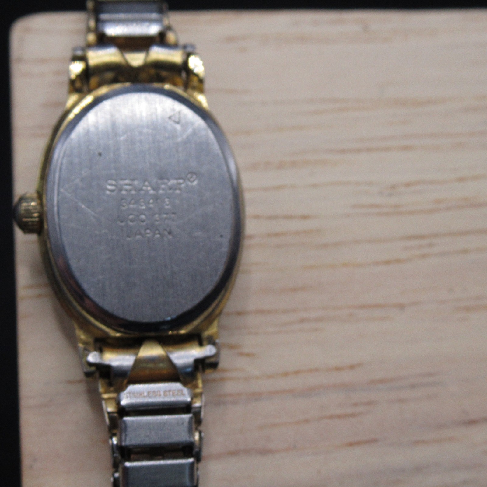 Sharp Quartz Women’s Watch Oval Black Dial Gold Tone Bezel Silver Band Japan