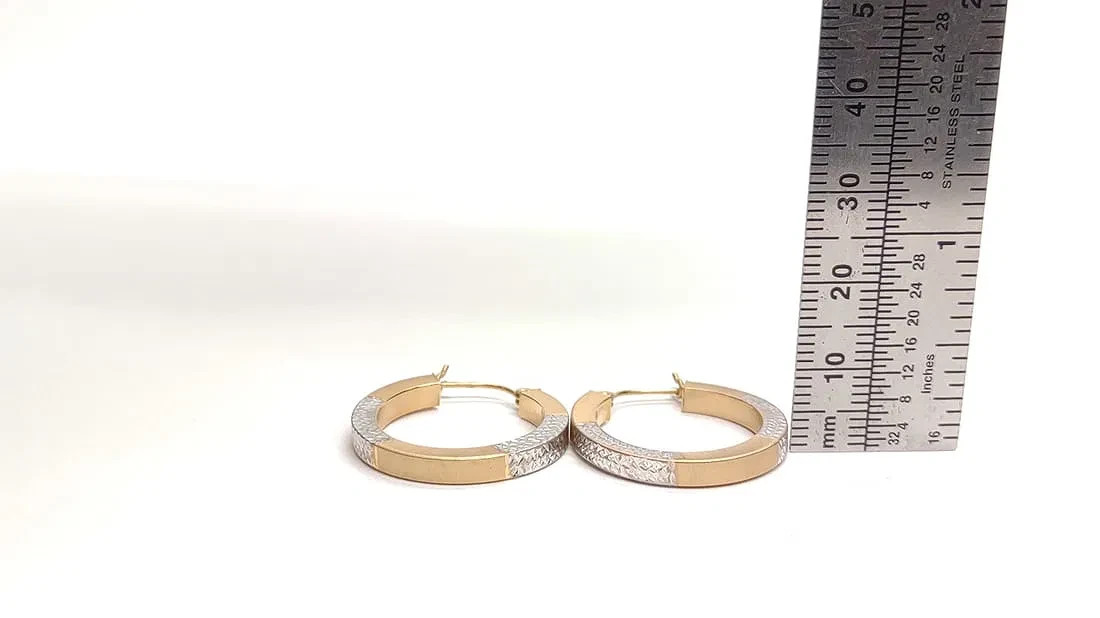 14 karat white and yellow gold hoop earrings. 25mm diameter
