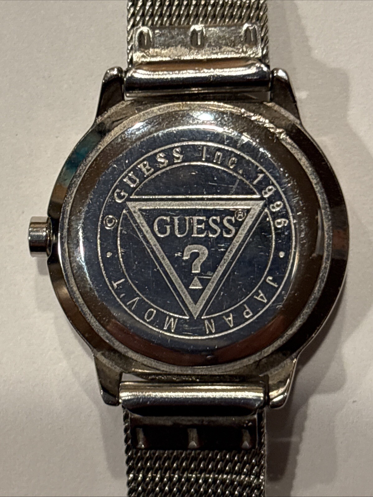 1996 GUESS numberless face watch. silver w adjustable mesh band. new battery.