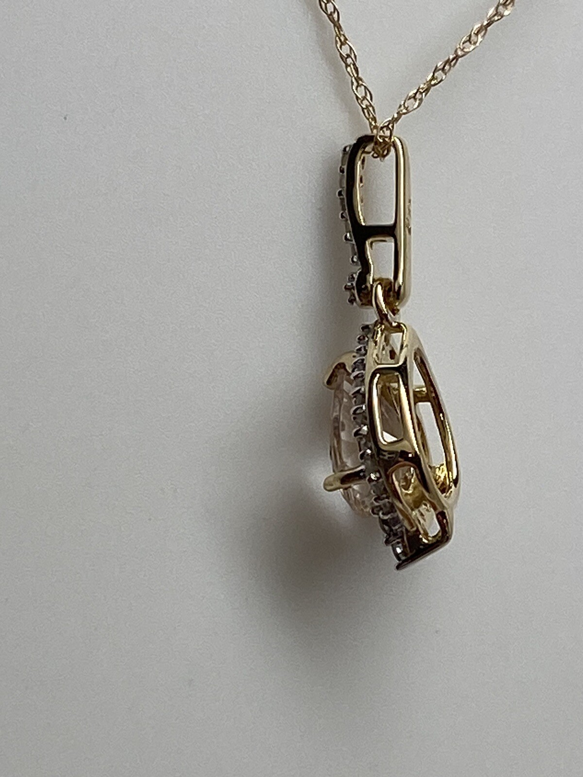 10K Yellow Gold Pear Shape Morganite and 0.11ct twt. Diamond Pendant with Chain