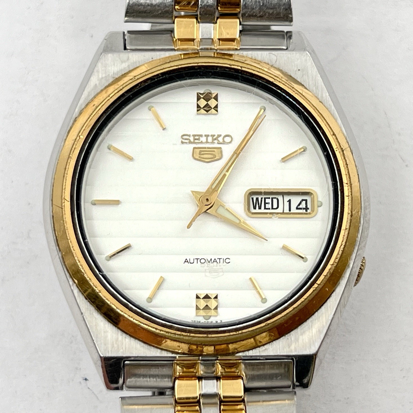 Seiko 5 Automatic Day/Date Steel Gold Tone White Teaked Dial 38mm Watch SNX166