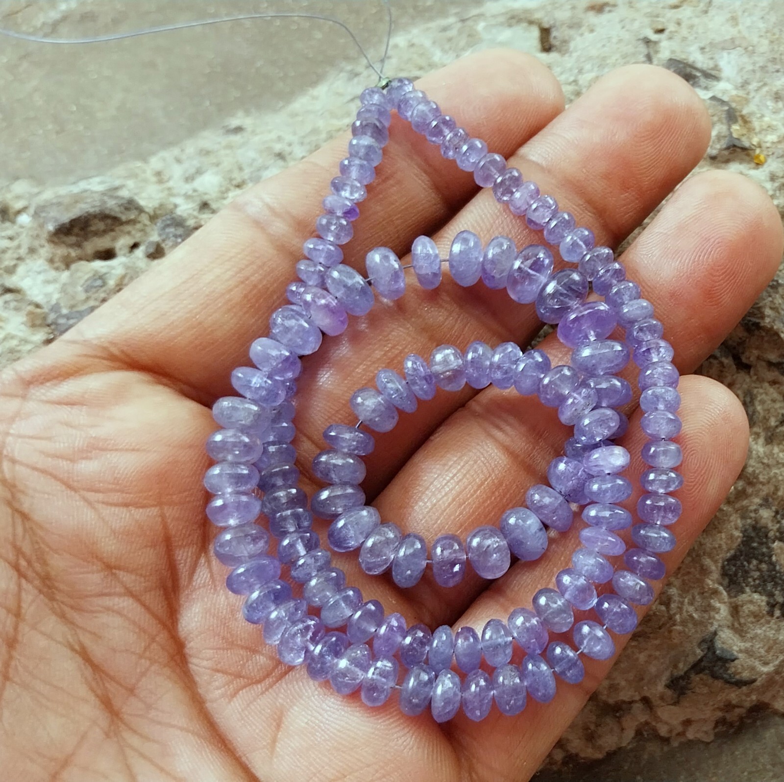 141 Carat 4.5 to 8 MM Natural Light Blue Color Smooth Tanzanite 17 Inch Beads