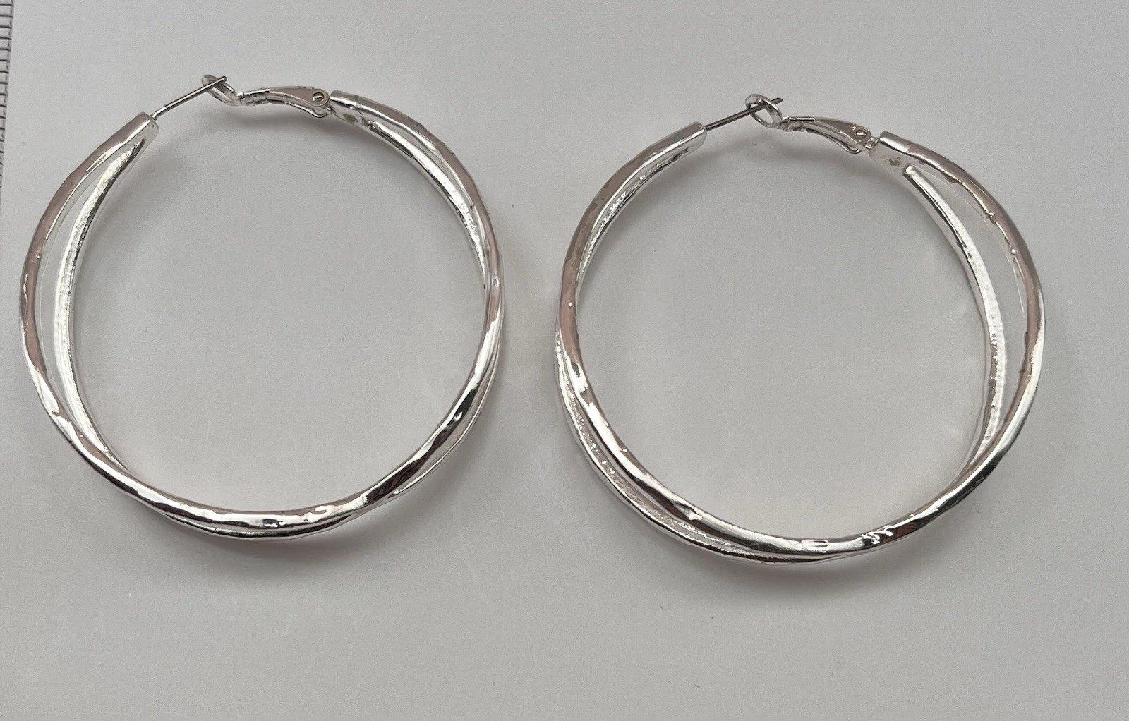 large silver-tone twisted hoop earrings