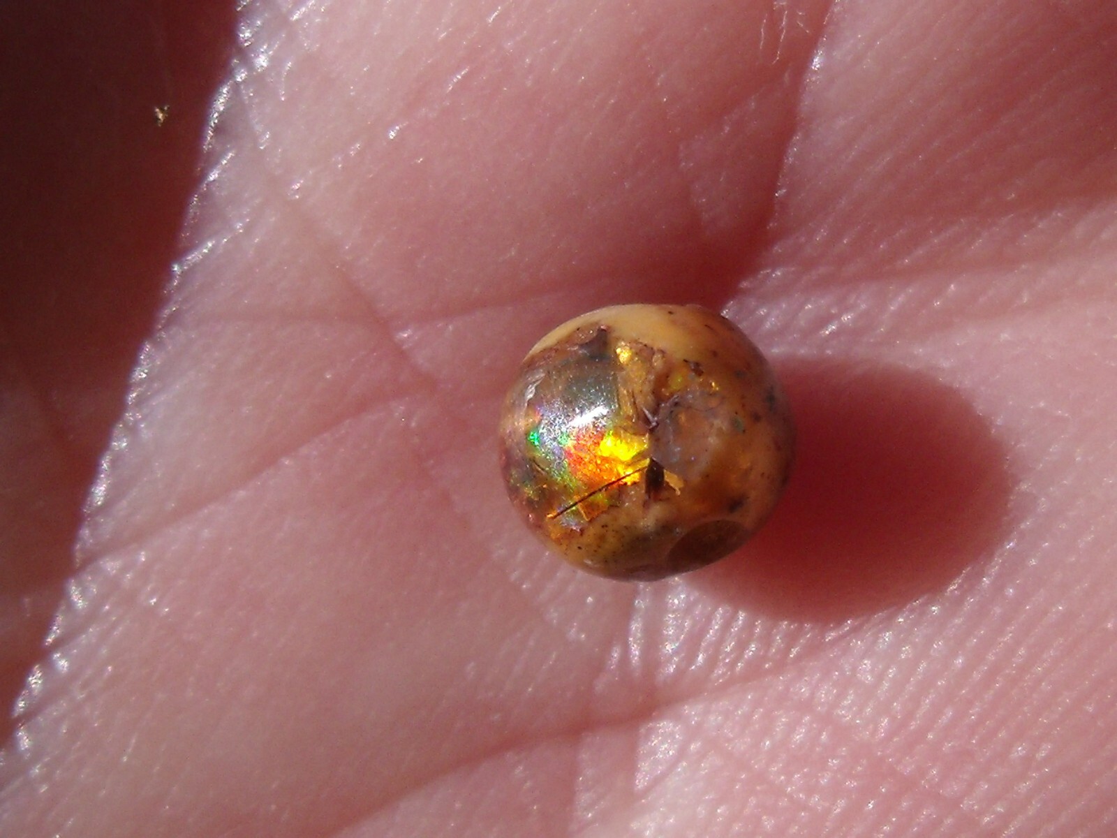 0.82 Ct. Round Cut Mexican Cantera fire opal bead.