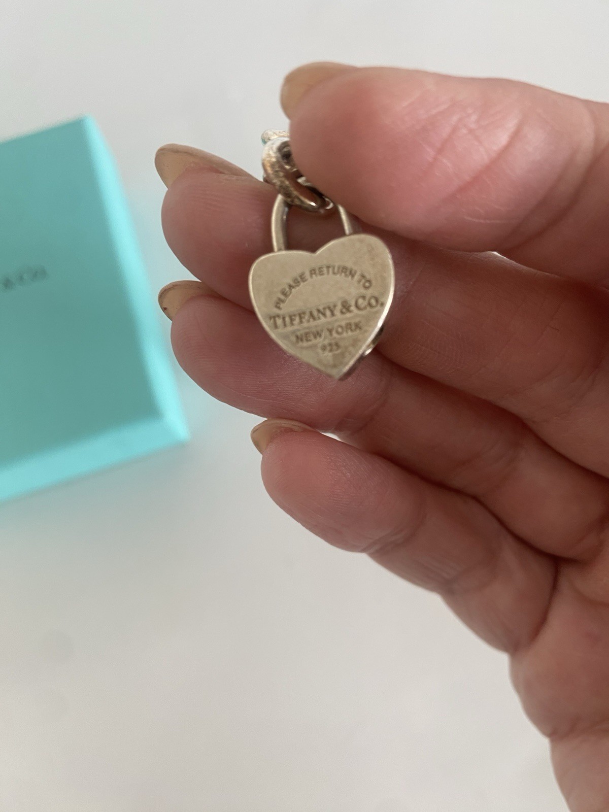 Tiffany & Co. Sterling Silver Charm Bracelet with 2 Charms Length 71/2 Inches