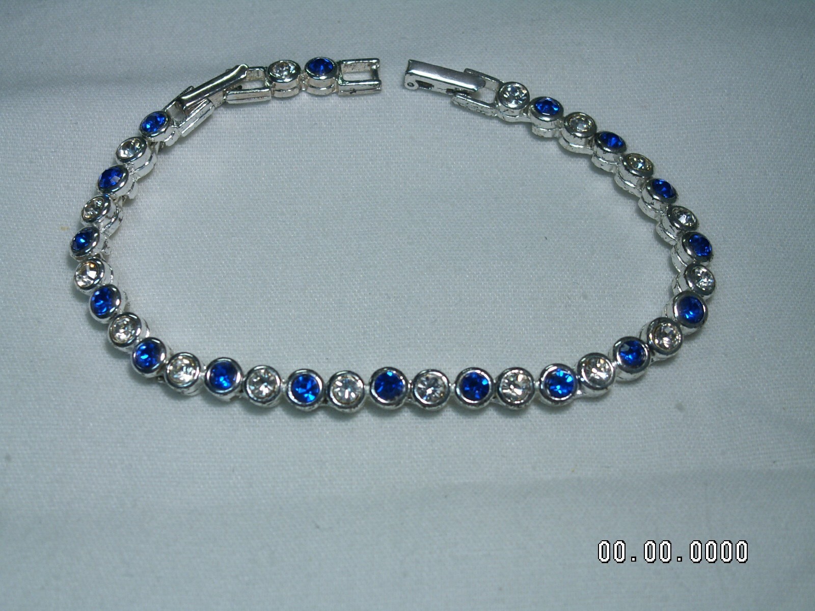 2002 AVON…Silver Tone,Sapphire Blue Crystals Bracelet & Pierced Earrings Set