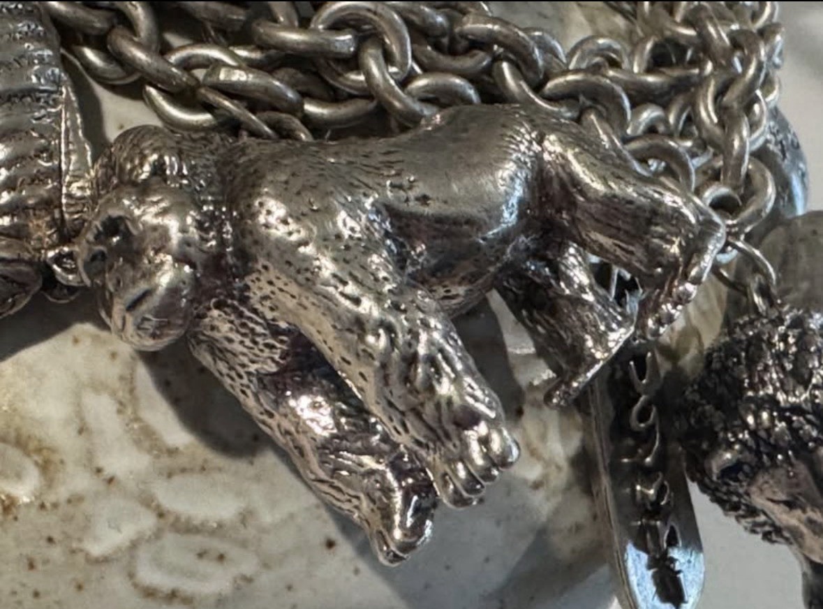 Signed Susan Cummings statement sterling silver African animal charm bracelet