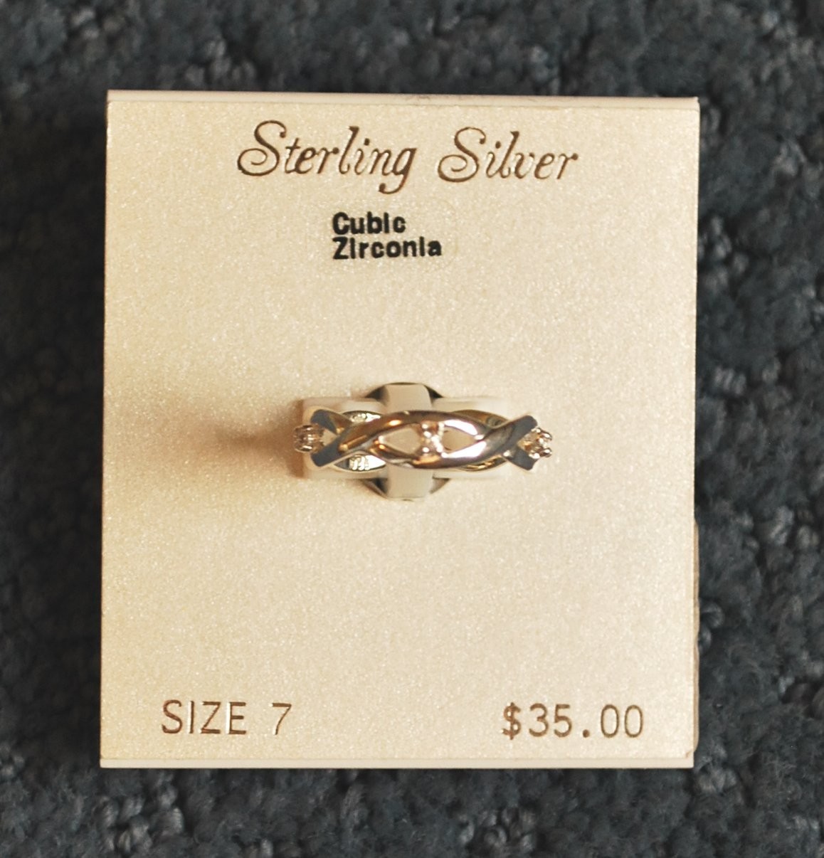 NWT – Sterling Silver Cubic Zirconia ring (size 7) weave design – MSRP $35