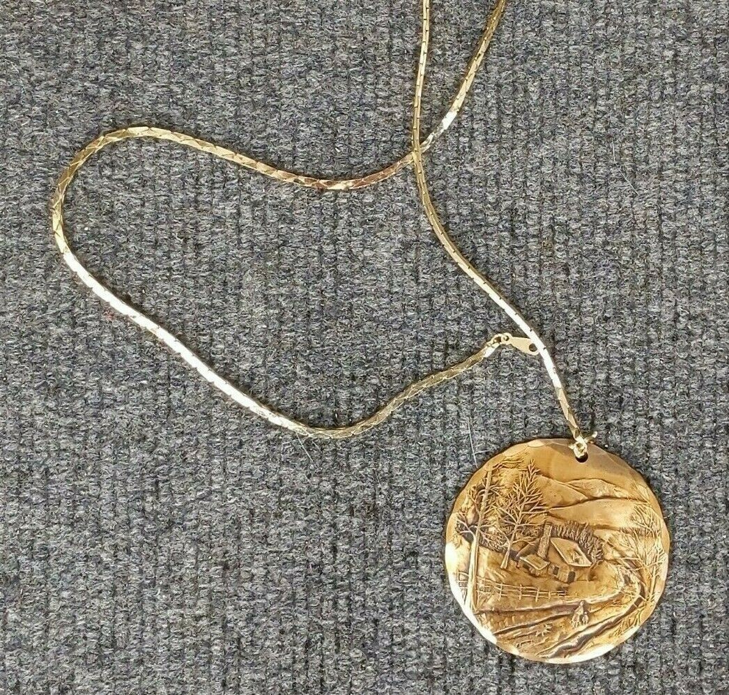 Natale winter scene medallion pendant 2 1/8 in d; dated 1982 handmade bronze