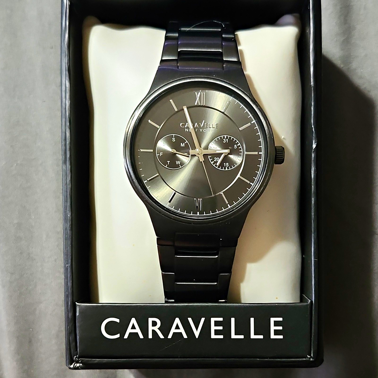 Caravelle New York Men’s Quartz Day/Date 43mm Black SS Watch Gray Dial Box