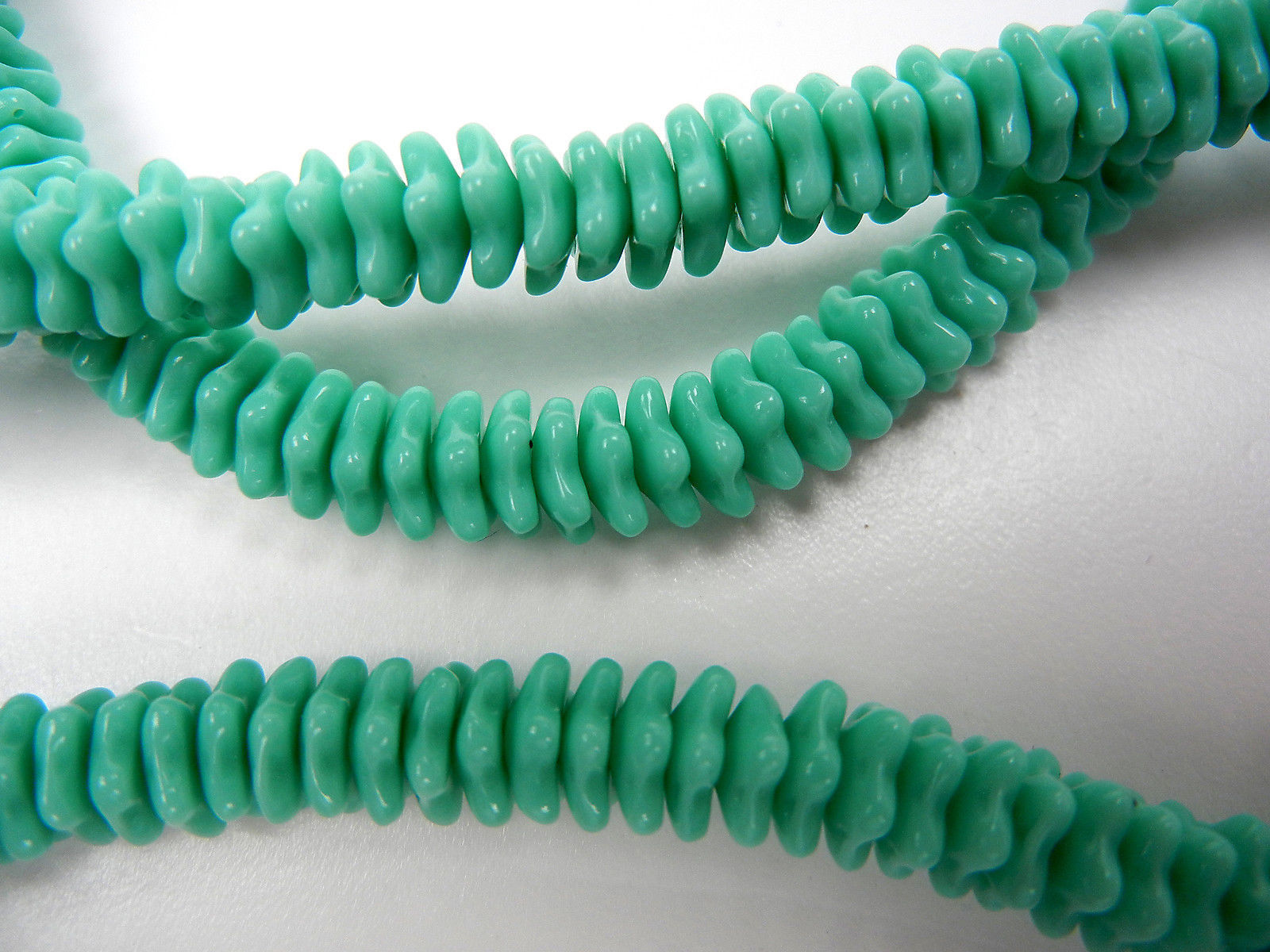 192 Czech glass flat flower star bead cups 7x3mm Opaque Green, 16 inch strand