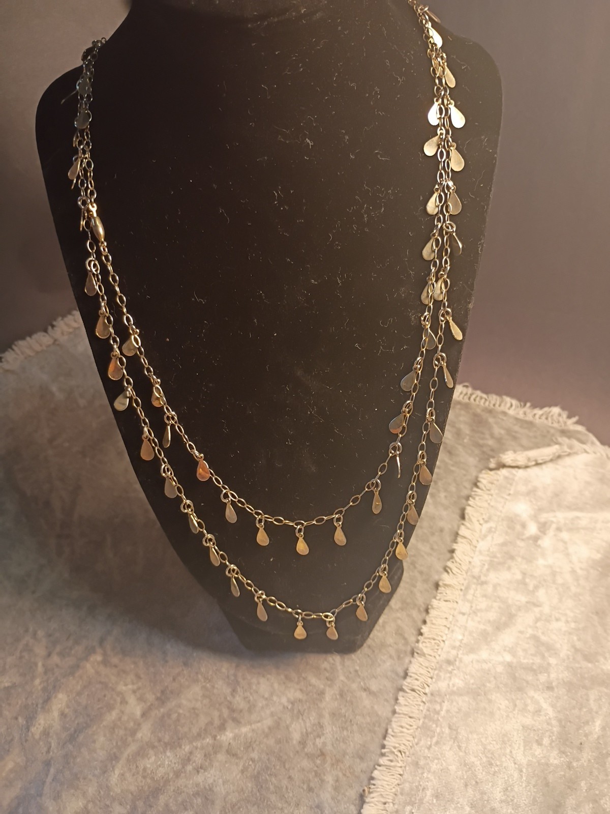 Gold Toned Tear Drop Charmed 56 Inch Taper Single Strand Necklace. J2