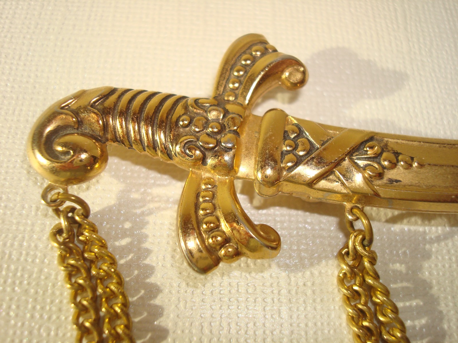 VINTAGE LOT(3) BROOCHES,CHINESE DRAGON,J.J RUSSIAN CATHEDRAL,M/EAST DAGGER PERF.