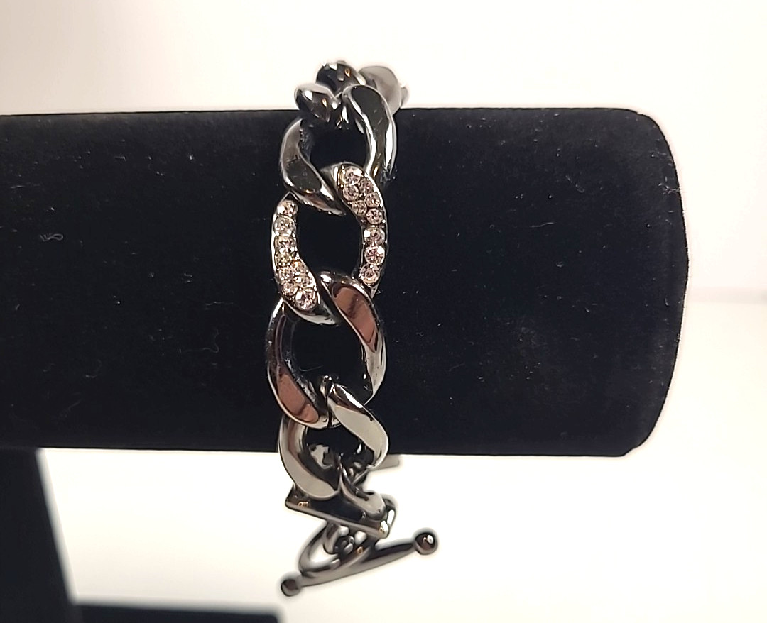 Gunmetal Toned Curb Link Bracelet with Crystal Accents.