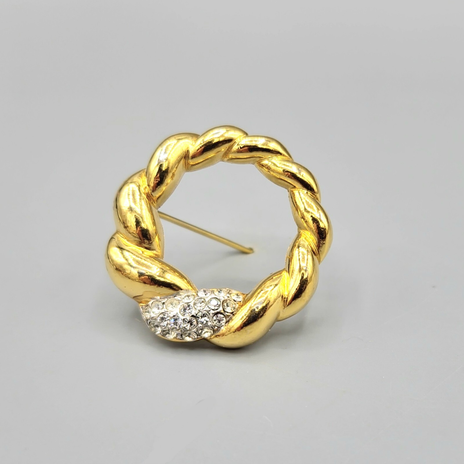 Crown Trifari Polished Gold Tone Crystal Pave Open Circle Twist Brooch