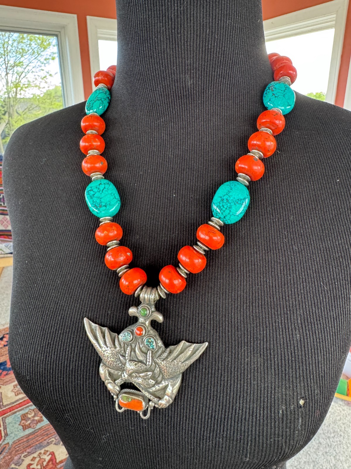 Silver Garuda pendant strung with natural coral and turquoise