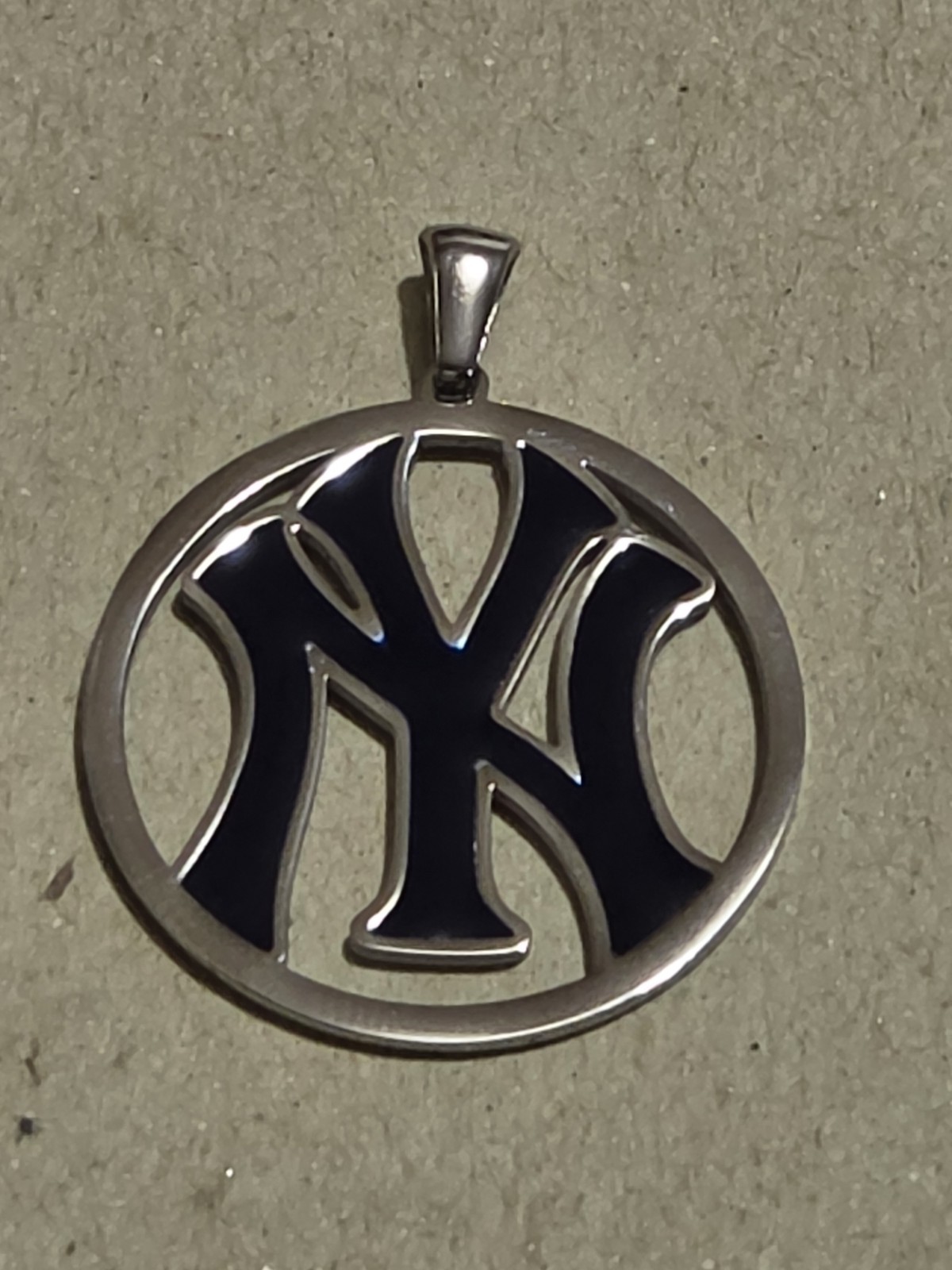 NY YANKEES BLUE NY STAINLESS STEEL CHARM Is 1.5″ High By 1″ Wide