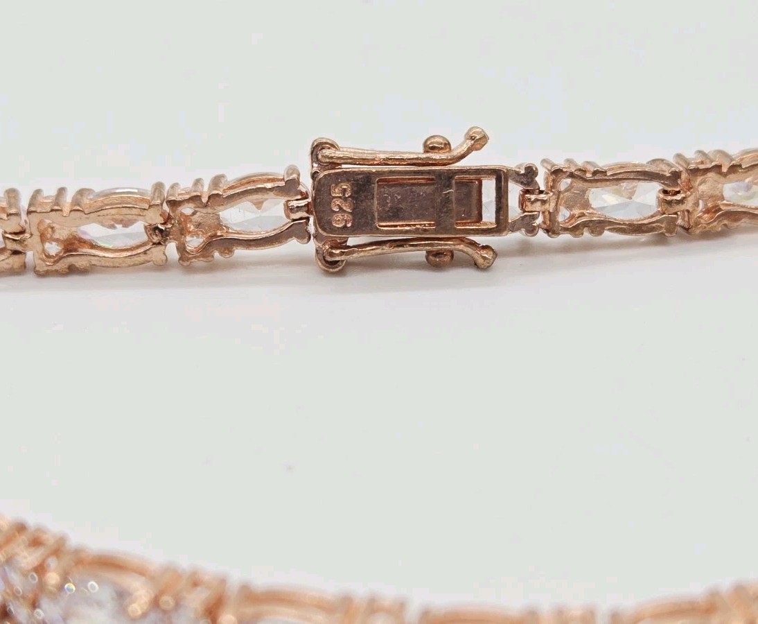 Tennis Bracelet White Oval Crystal rhinestone signed 925 Rose Gold tone 7.25 in