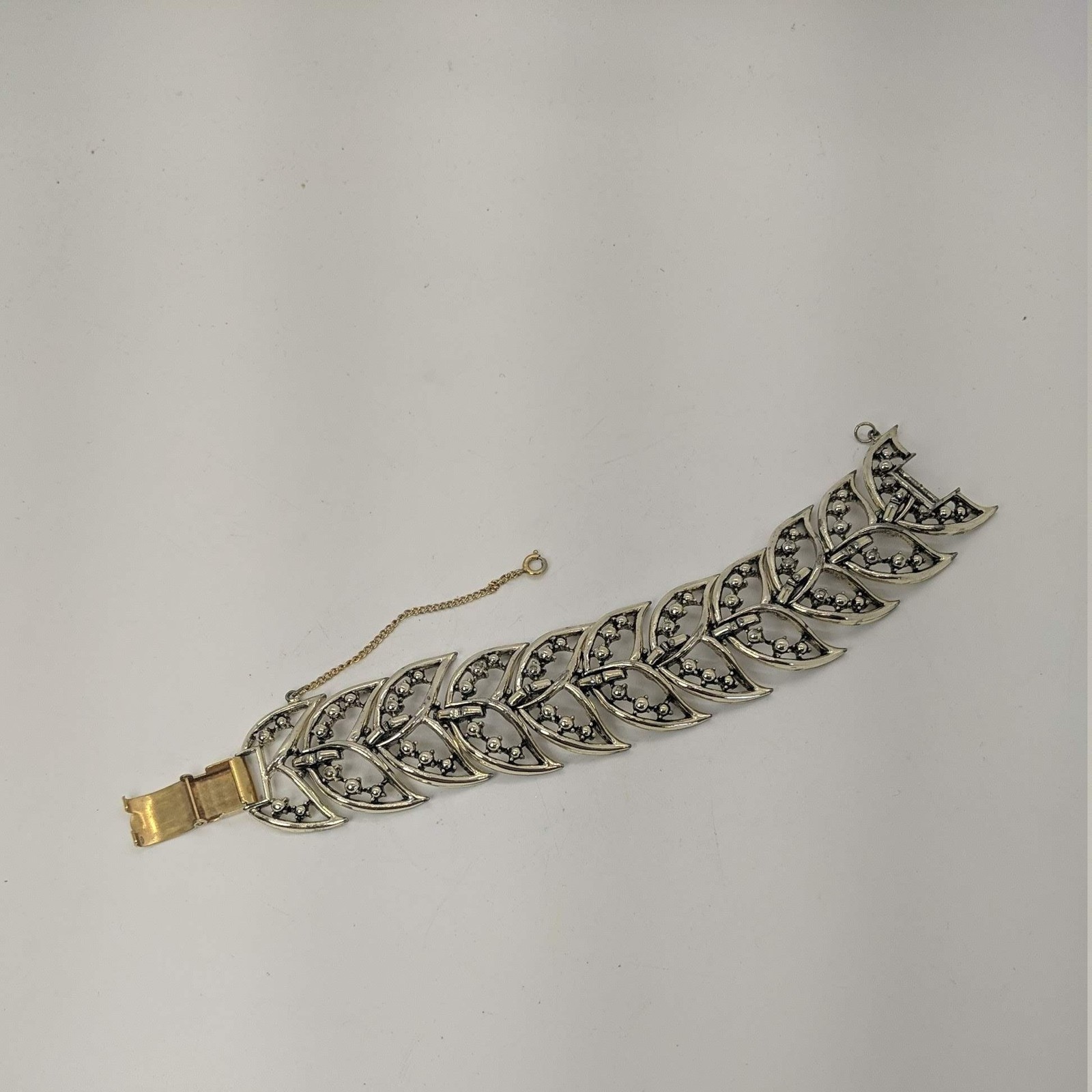 Rousseau Link BRACELET Gold Tone Panels Tail Leaf Fold Over Clasp Safety Chain