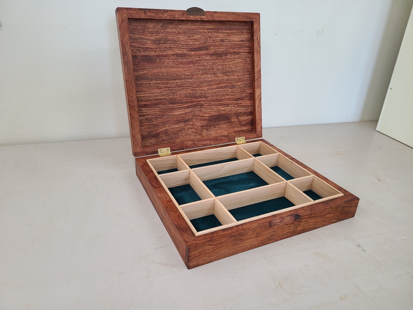 a beautiful bubinga jewelry/valet box. Made of solid bubinga with maple dividers
