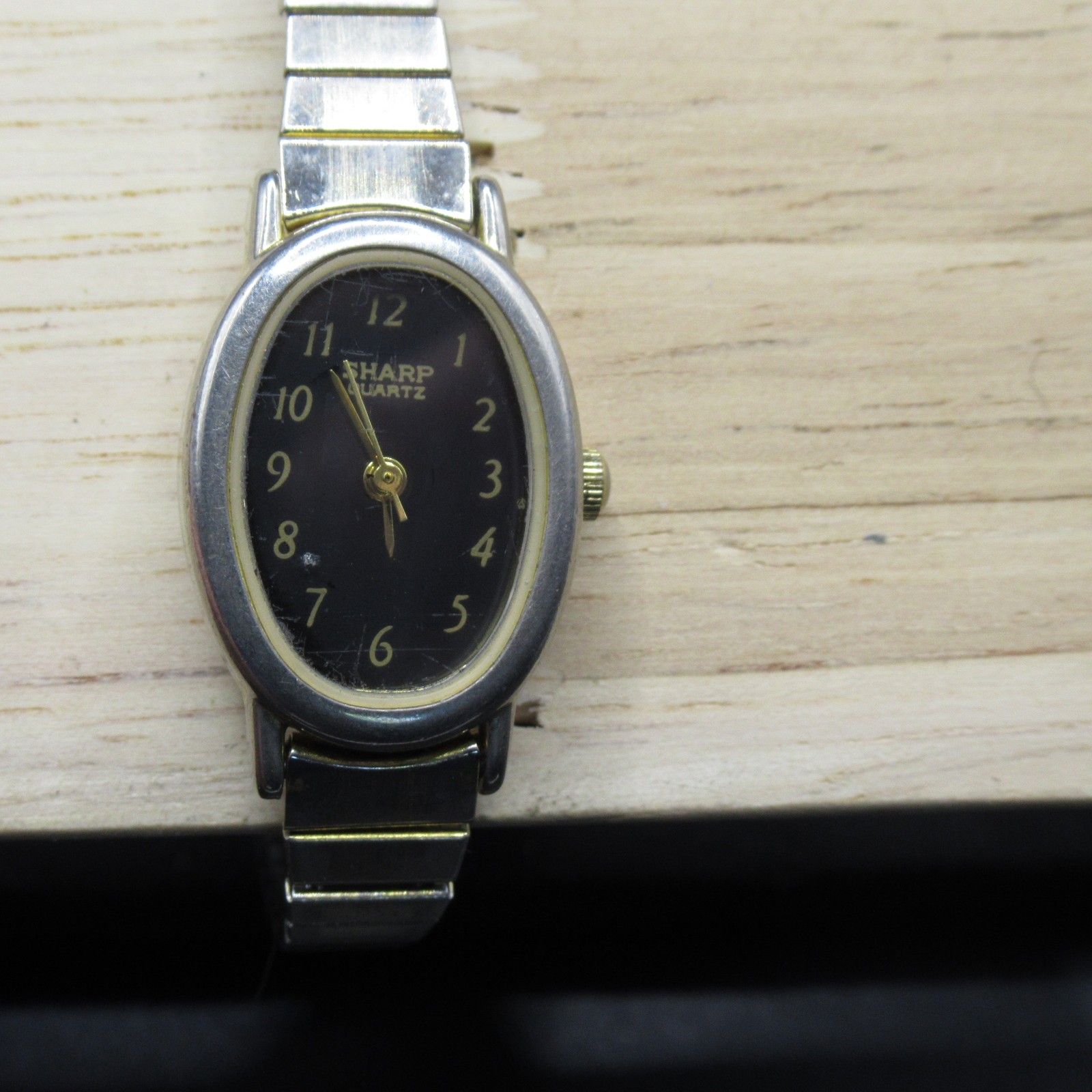 Sharp Quartz Women’s Watch Oval Black Dial Gold Tone Bezel Silver Band Japan