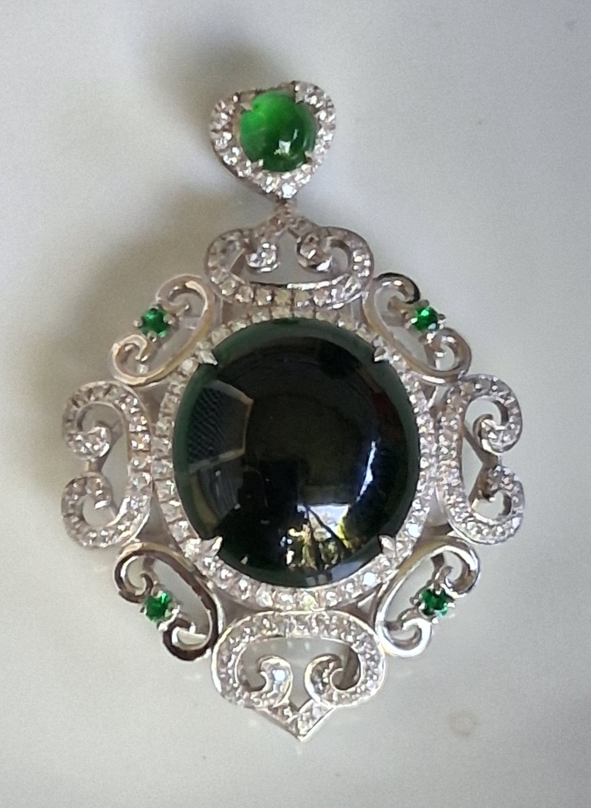 Silver Tone Ornate Scrollwork Oval Pendant Green Oval Cabochon & Accents