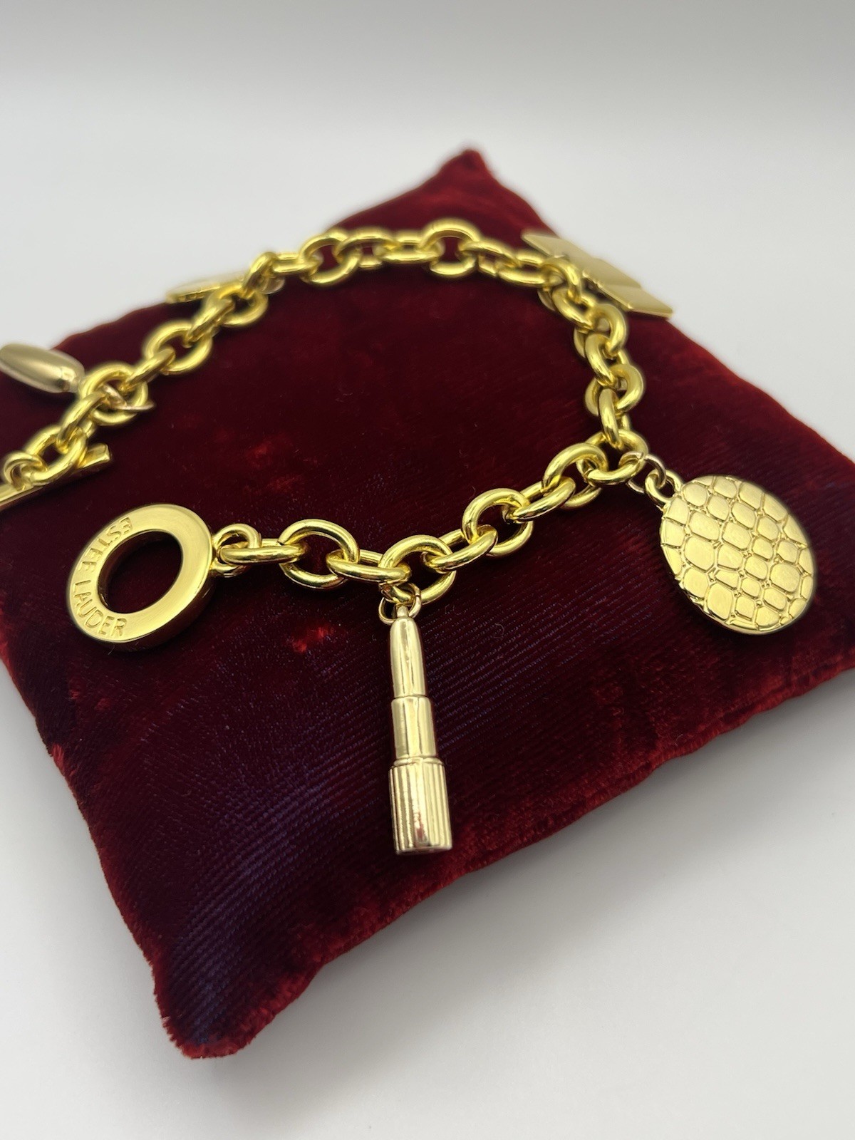 Vintage ESTEE LAUDER Runway Gold Tone Charm Bracelet Couture 7.5 ”