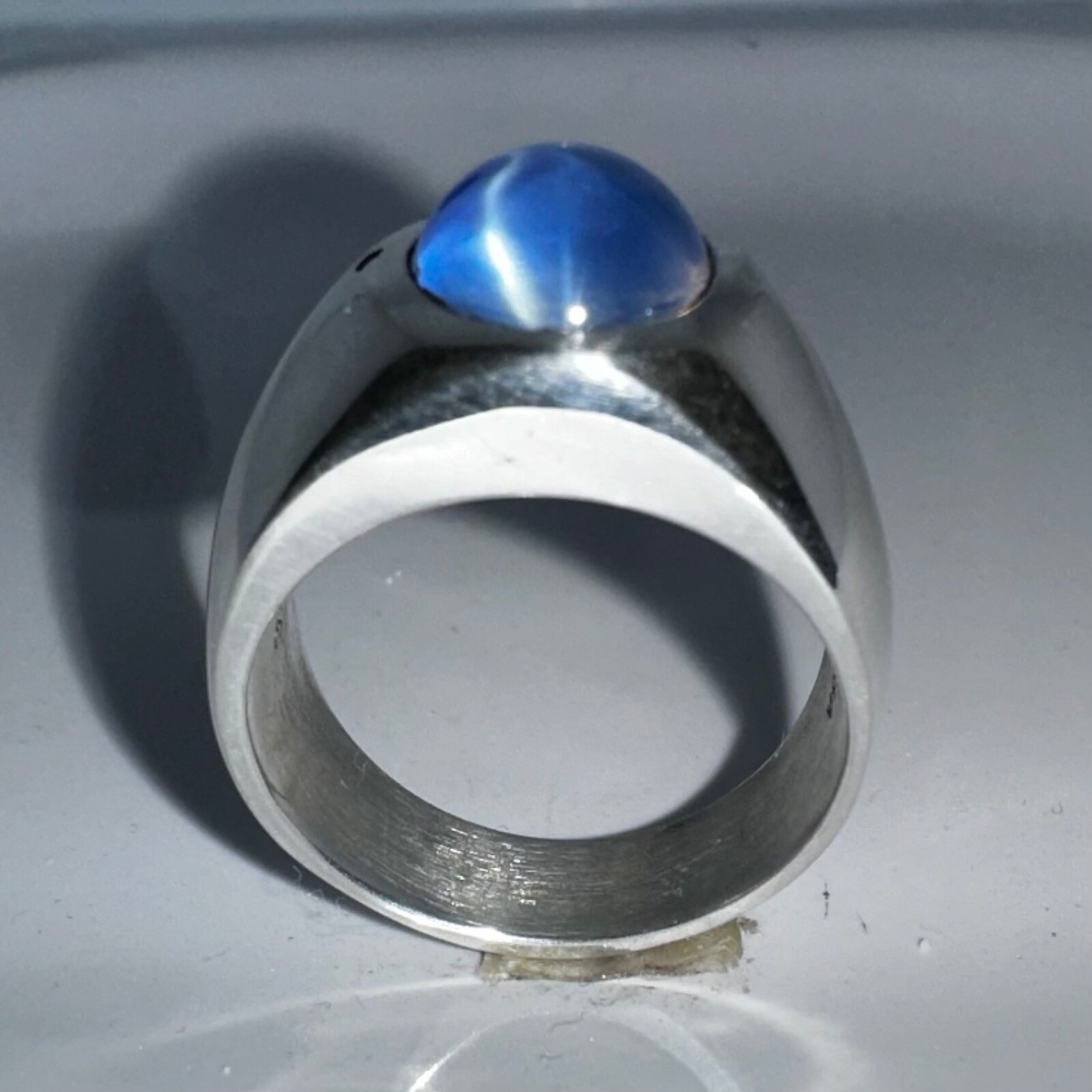 MJG STERLING SILVER BEZEL RING. 12 x 10mm OVAL LAB STAR SAPPHIRE. SZ 9.5